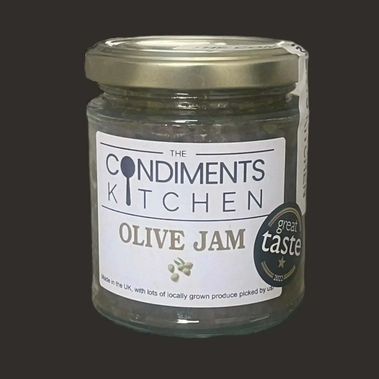 Jar of The Condiments Kitchen Olive Jam chutney and relish in 195g container with a label showing green olives and natural ingredients.