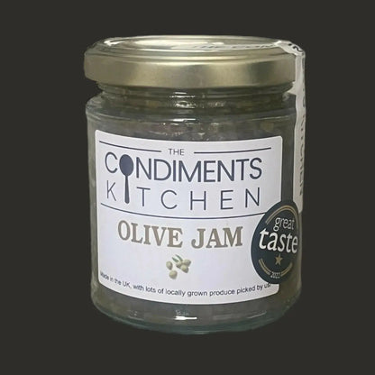 Jar of The Condiments Kitchen Olive Jam chutney and relish in 195g container with a label showing green olives and natural ingredients.