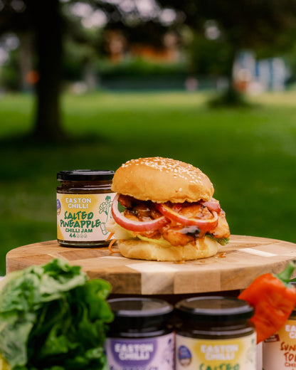 Salted pineapple chilli jam from Easton Chilli, showcasing a jar of spicy sweet chilli jam with pineapple chunks and chili peppers.