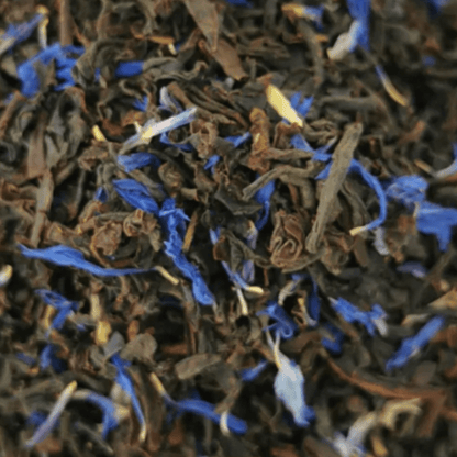 Black Earl of Colne Valley tea leaves from Porter Hill Tea Company, showcasing dried tea leaves in a natural setting.