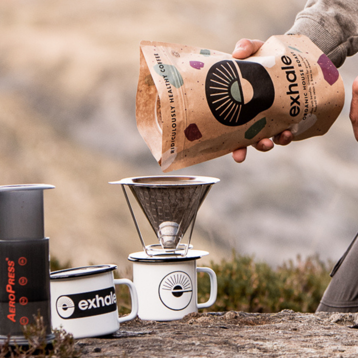 Organic house roast coffee from Exhale Healthy Coffee, showing a bag of freshly roasted coffee beans with a warm, inviting appearance.