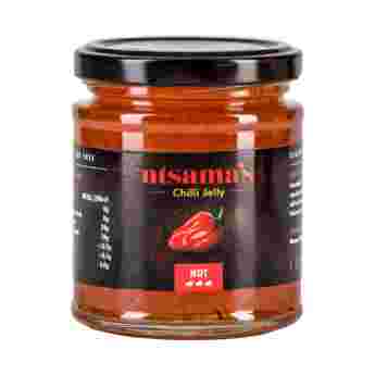 Ntsama Hot Chilli Jelly in a glass jar with a red chili pepper, showcasing vibrant red chili jelly and fresh chili peppers.