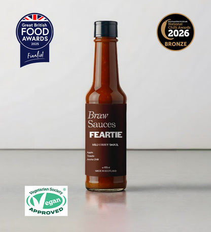 Braw Sauces Feartie Hot Sauce bottle with label, showcasing vibrant orange and red colors on a white background.
