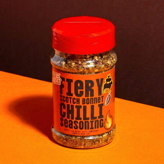 Fiery Scotch Bonnet chilli seasoning by The GOAT Seasoning Blends in a 210g shaker bottle with red and orange spices.