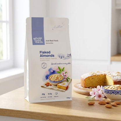 Whole Food Earth flaked almonds in a bowl, showcasing thin, toasted almond slices from the nuts and seeds category.