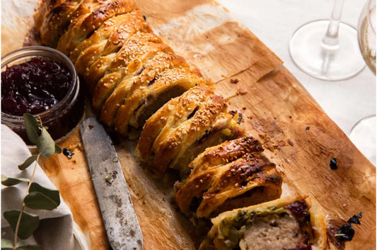 Primrose Herd gluten-free pork sausage meat, raw sausage meat with seasoned pork visible in a close-up image.