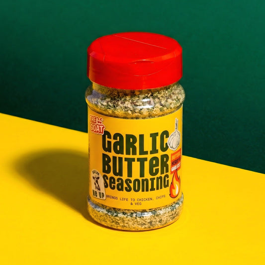 Garlic Butter Seasoning from The GOAT Seasoning Blends in a 180g shaker bottle, with a close-up of the seasoned blend.