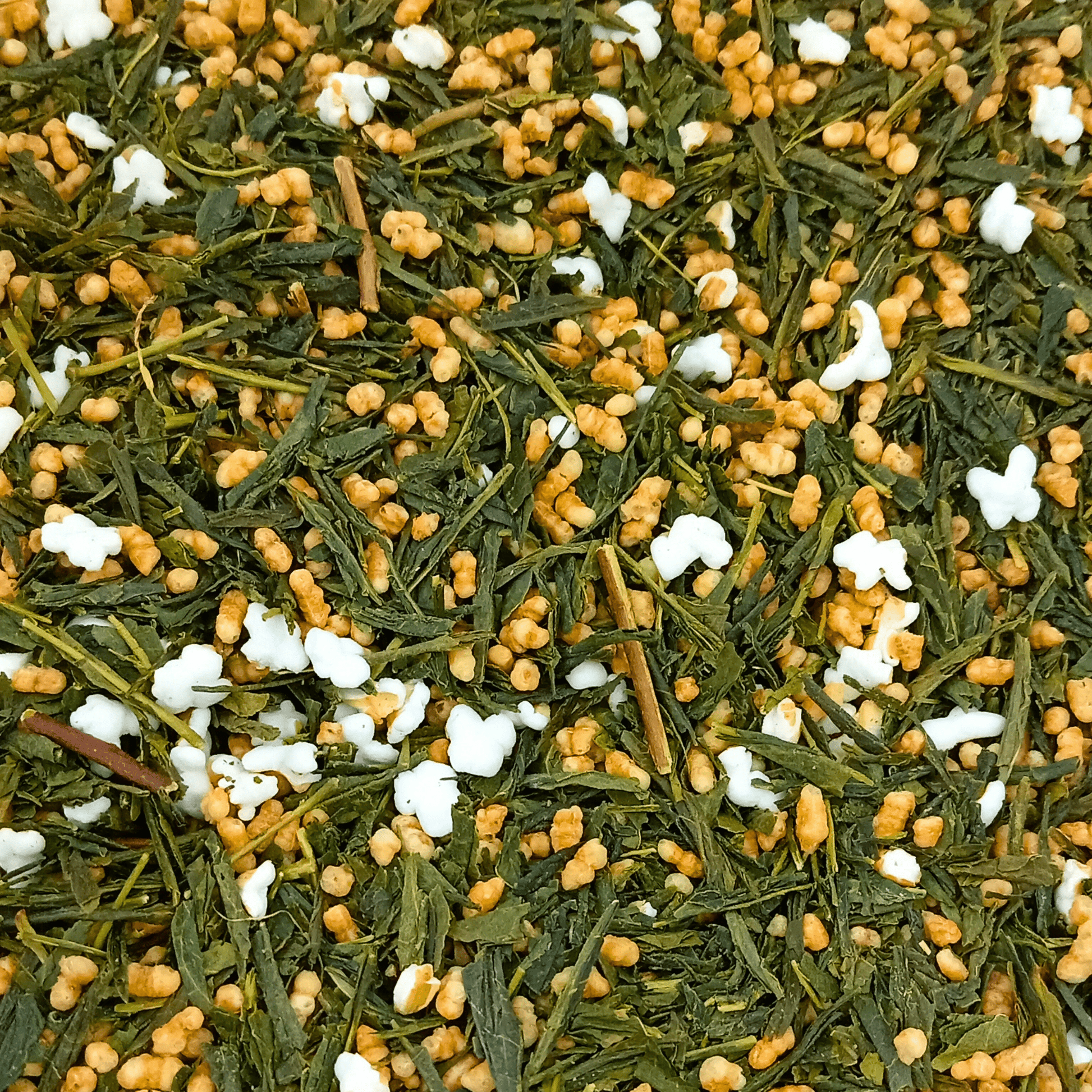 Porter Hill Tea Company Genmaicha green tea in a clear teacup, showcasing the light green brewed tea with roasted rice grains.