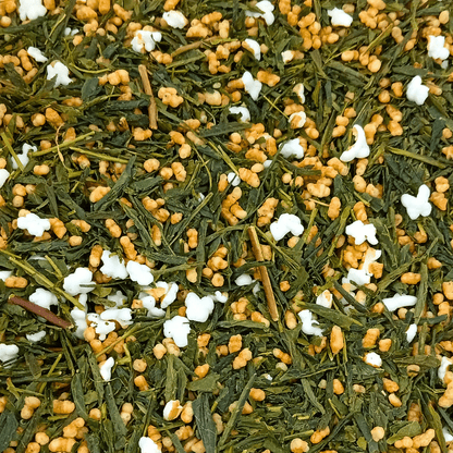 Porter Hill Tea Company Genmaicha green tea in a clear teacup, showcasing the light green brewed tea with roasted rice grains.