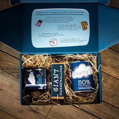 Harry's Hot Chocolate making kit in a gift box, includes hot chocolate mix and accessories for a cozy chocolate experience.