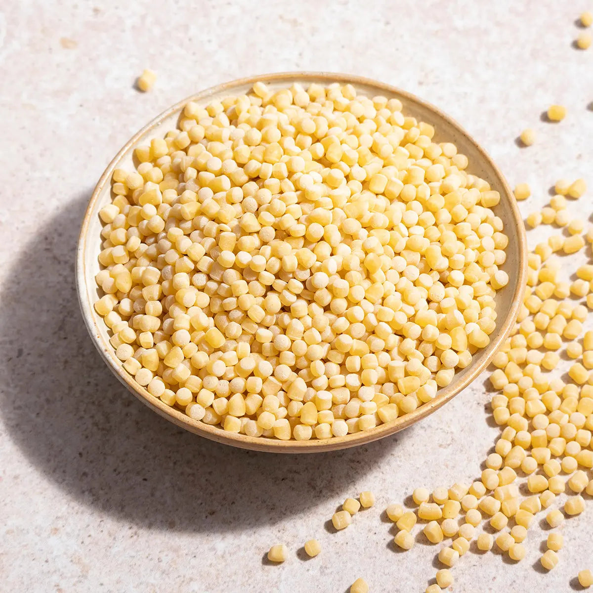 Whole Food Earth giant couscous, a close-up of the light, fluffy rice and couscous grains in a bowl.