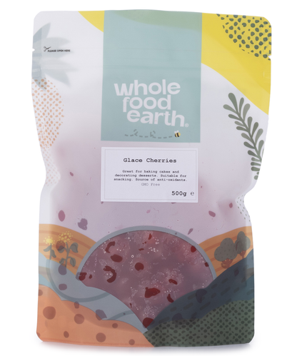 Dried glace cherries in a clear bag, Whole Food Earth brand, showcasing shiny, red preserved cherries for baking or snacking.