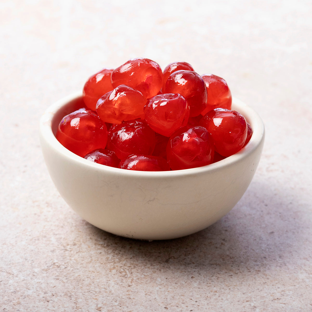 Dried glace cherries from Whole Food Earth, showing glossy, red candied cherries on a white background.