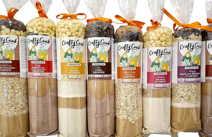 Crafty Cook Hamper10 savory and sweet bundle with gluten-free puddings, featuring an assortment of baked treats and desserts.