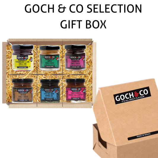 Exotic sauces taster box by Goch & Co with a variety of award-winning flavorful sauce bottles in a gift box.