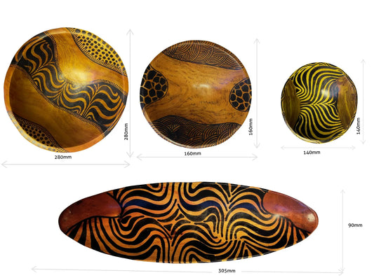 Hand-carved African wooden bowls by Goch & Co showcasing intricate patterns and natural wood grain, perfect for gifts and decor.