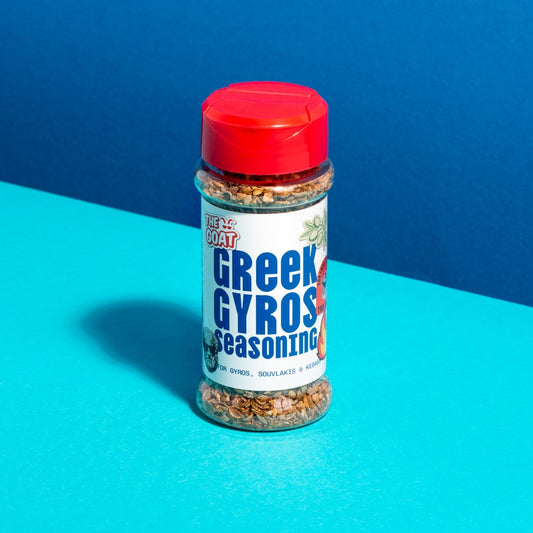 Shaker jar of Greek Gyros Seasoning by The GOAT Seasoning Blends, 60g, with a colorful label and spice blend inside.