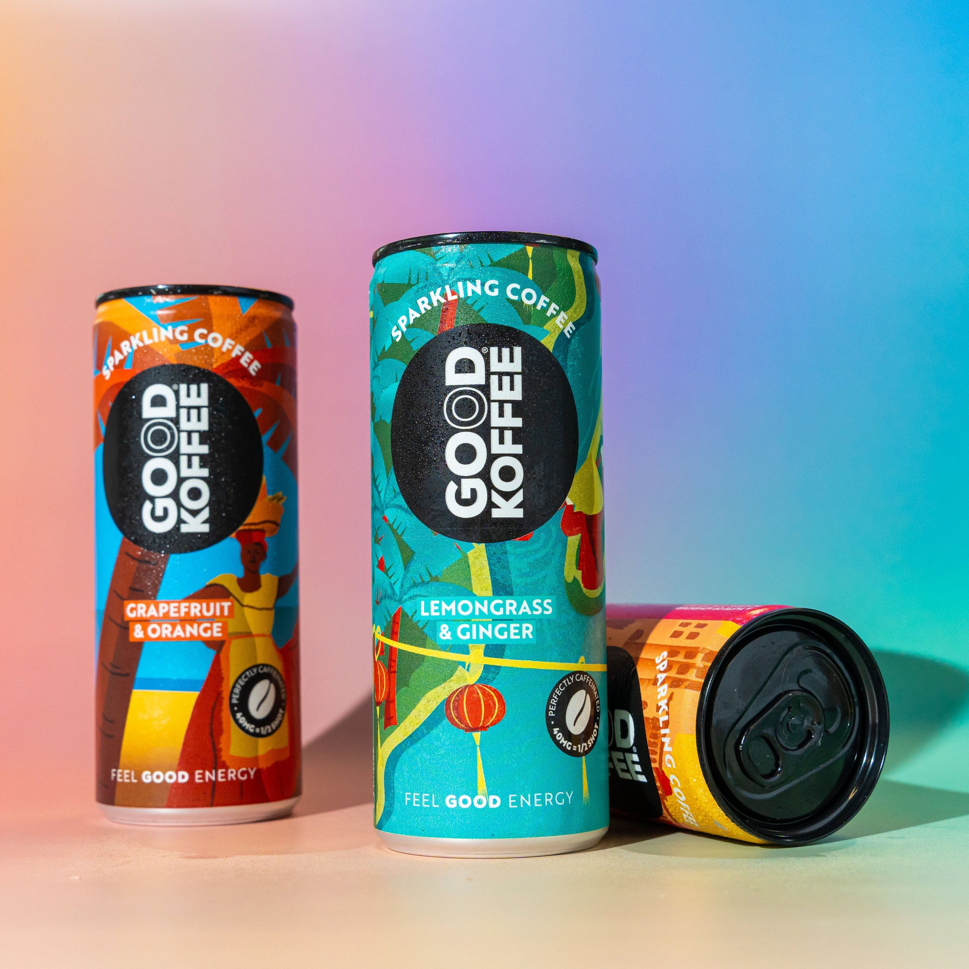 Three cans of GOOD KOFFEE sparkling coffee in a discovery taster box, showcasing colorful packaging and variety of flavors.