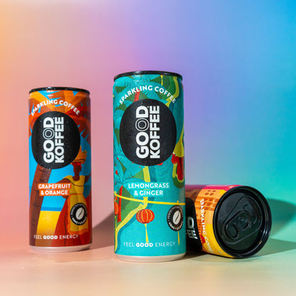 Three cans of GOOD KOFFEE sparkling coffee in a discovery taster box, showcasing colorful packaging and variety of flavors.