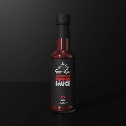 Spicy Ryes Hot Honey Pepper Sauce bottle with golden honey and red chili peppers, showcasing the hot sauce's vibrant ingredients.