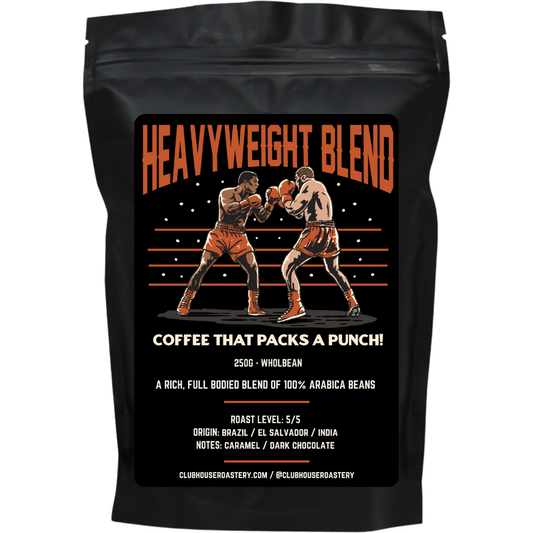 Bag of Clubhouse Roastery Heavyweight Blend dark roast coffee beans with rich, bold appearance in a colorful packaging image.
