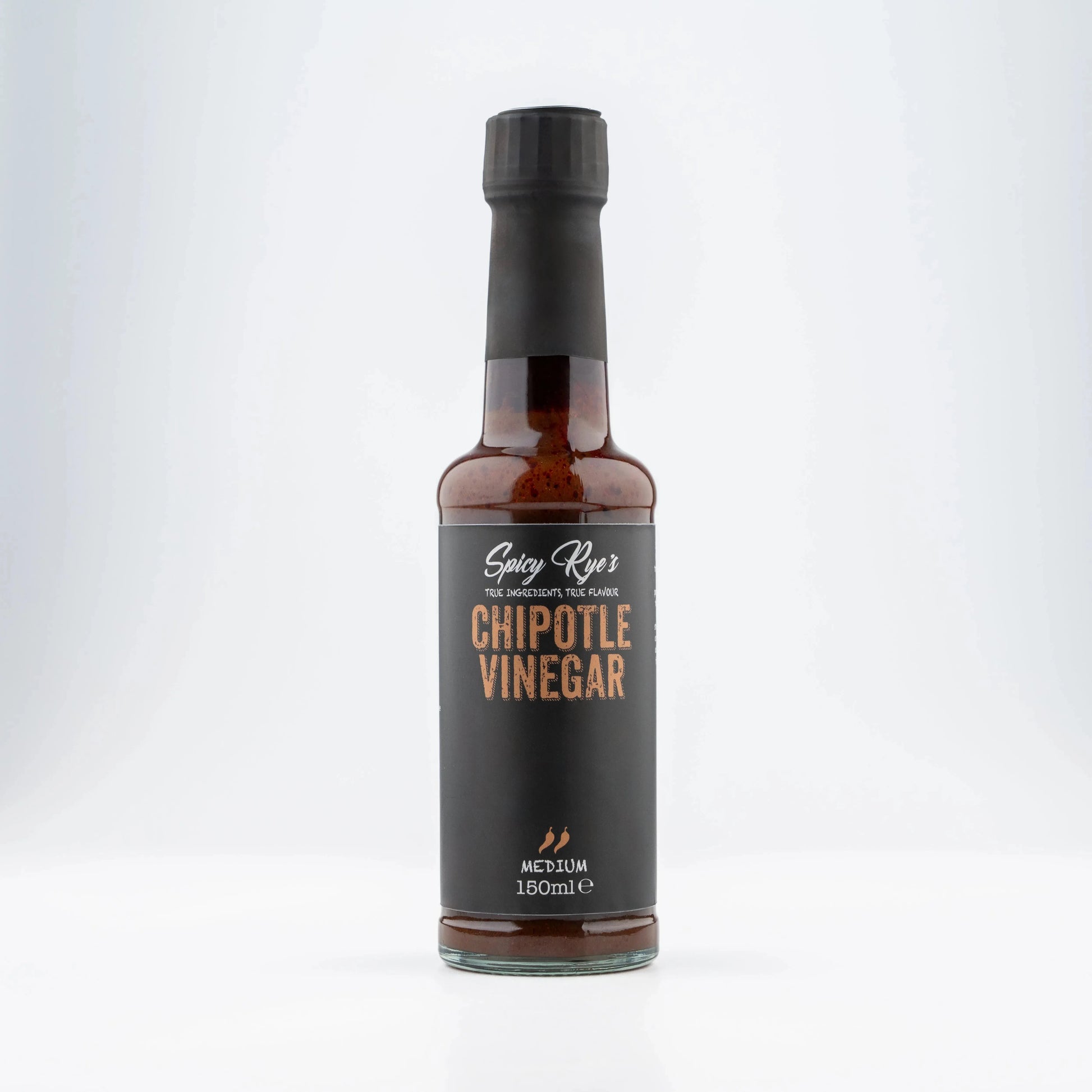 Spicy Ryes Chipotle Vinegar bottle with dark label and cap, close-up shot highlighting the product for culinary use.