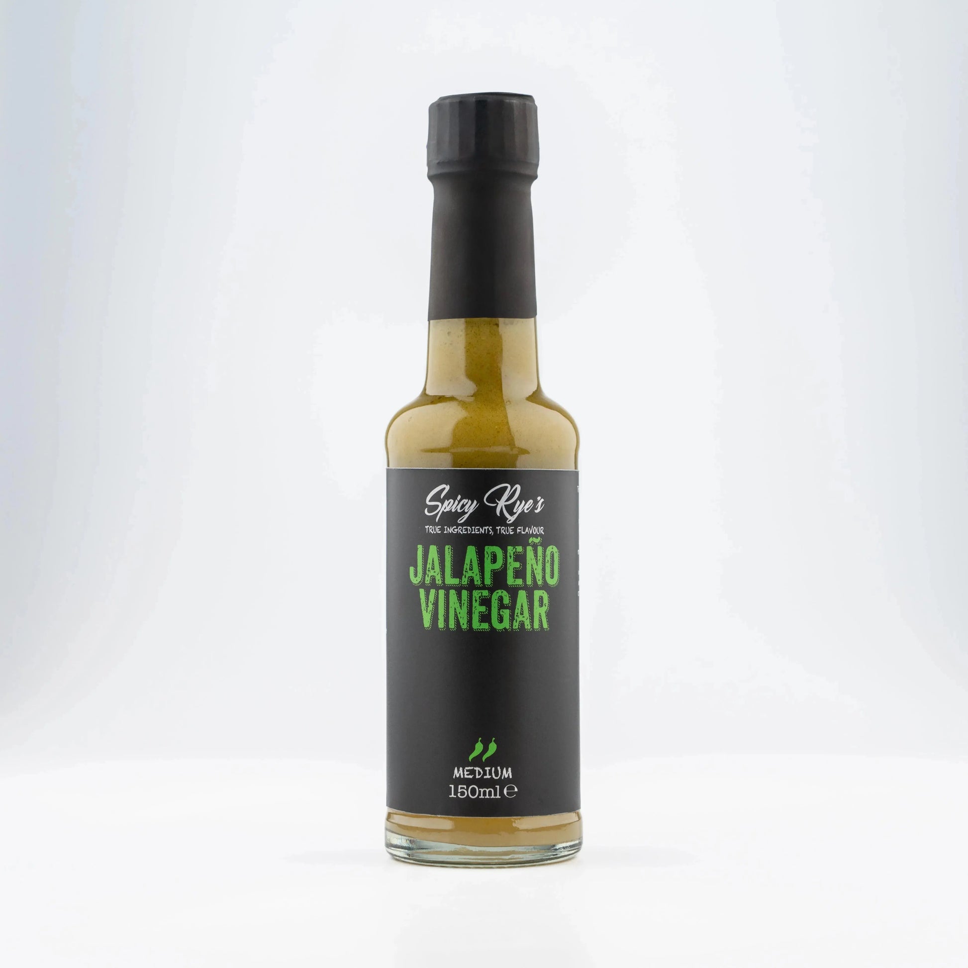 Spicy Ryes jalapeño vinegar bottle with vibrant green jalapeño peppers on the label, showcasing the spicy condiment.