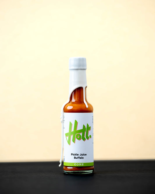 Hott Pickle Juice Buffalo Hott Sauce bottles with front labels, spicy hot sauce featuring pickle juice and buffalo flavor.