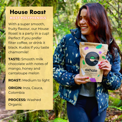 Organic house roast coffee from Exhale Healthy Coffee featuring a freshly brewed cup with rich, aromatic beans on a rustic table.