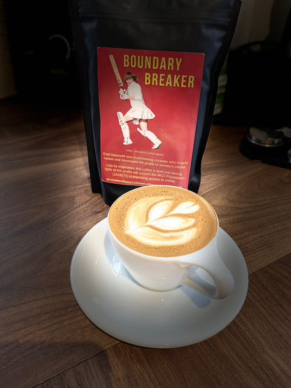 Bag of Boundary Breaker coffee beans from Clubhouse Roastery, featuring a dark roasted appearance and vibrant label design.