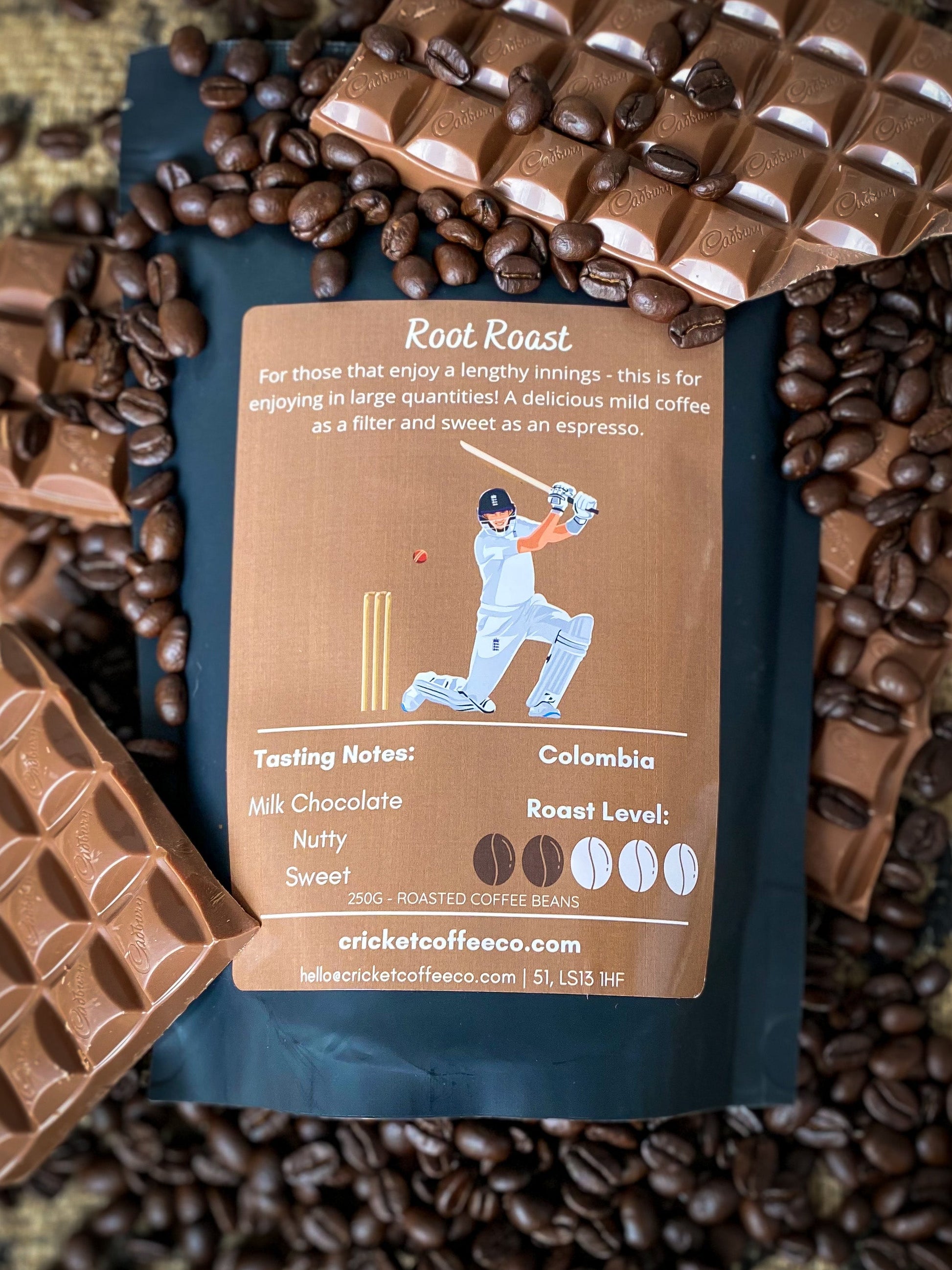 Fresh roasted Clubhouse Roastery Root Roast coffee beans in a burlap bag, showcasing rich brown color and textured surface.