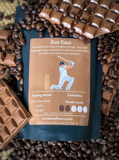 Fresh roasted Clubhouse Roastery Root Roast coffee beans in a burlap bag, showcasing rich brown color and textured surface.
