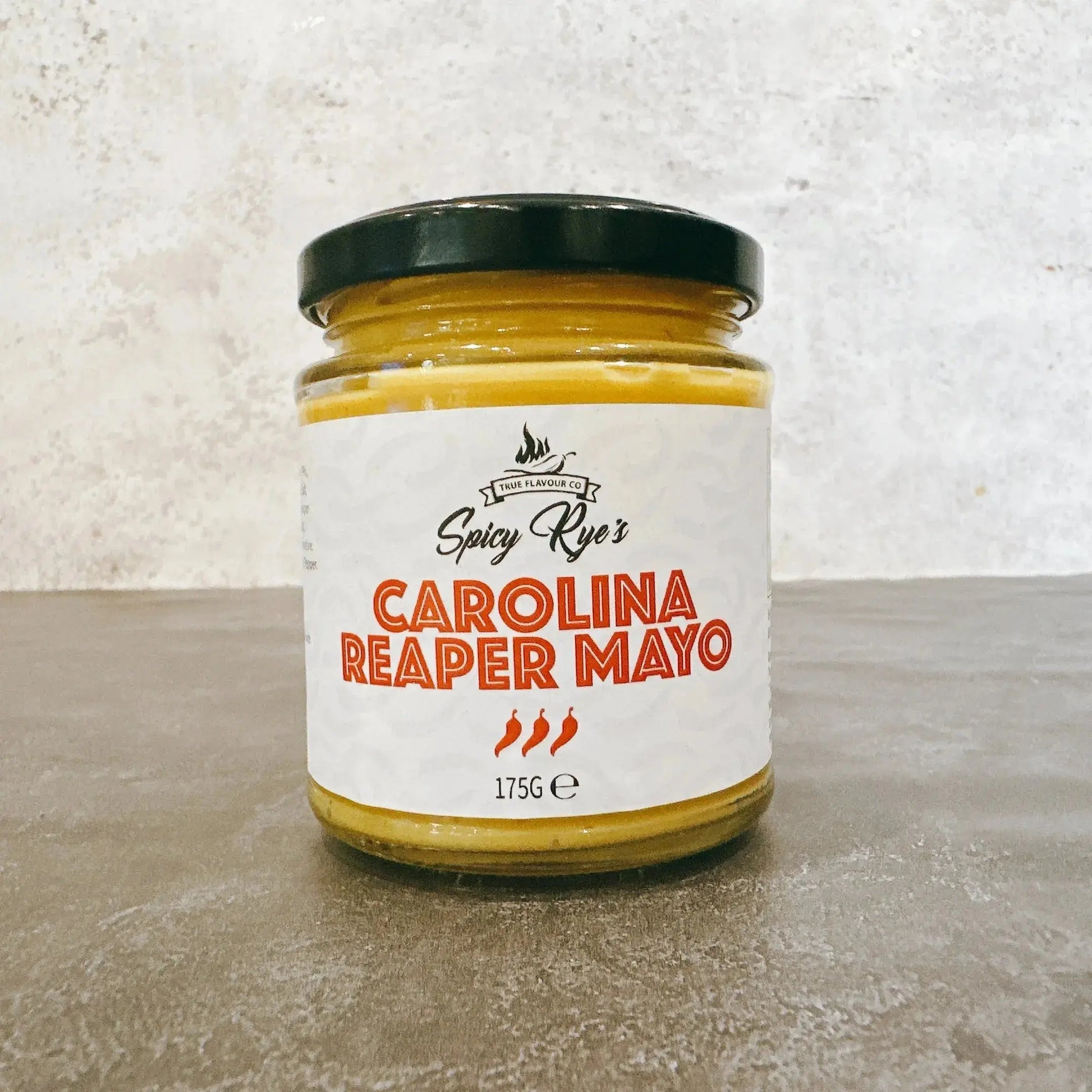 Spicy Ryes Carolina Reaper Mayo condiment bottle, creamy sauce with fiery chili pepper flavor, for spicy food lovers.