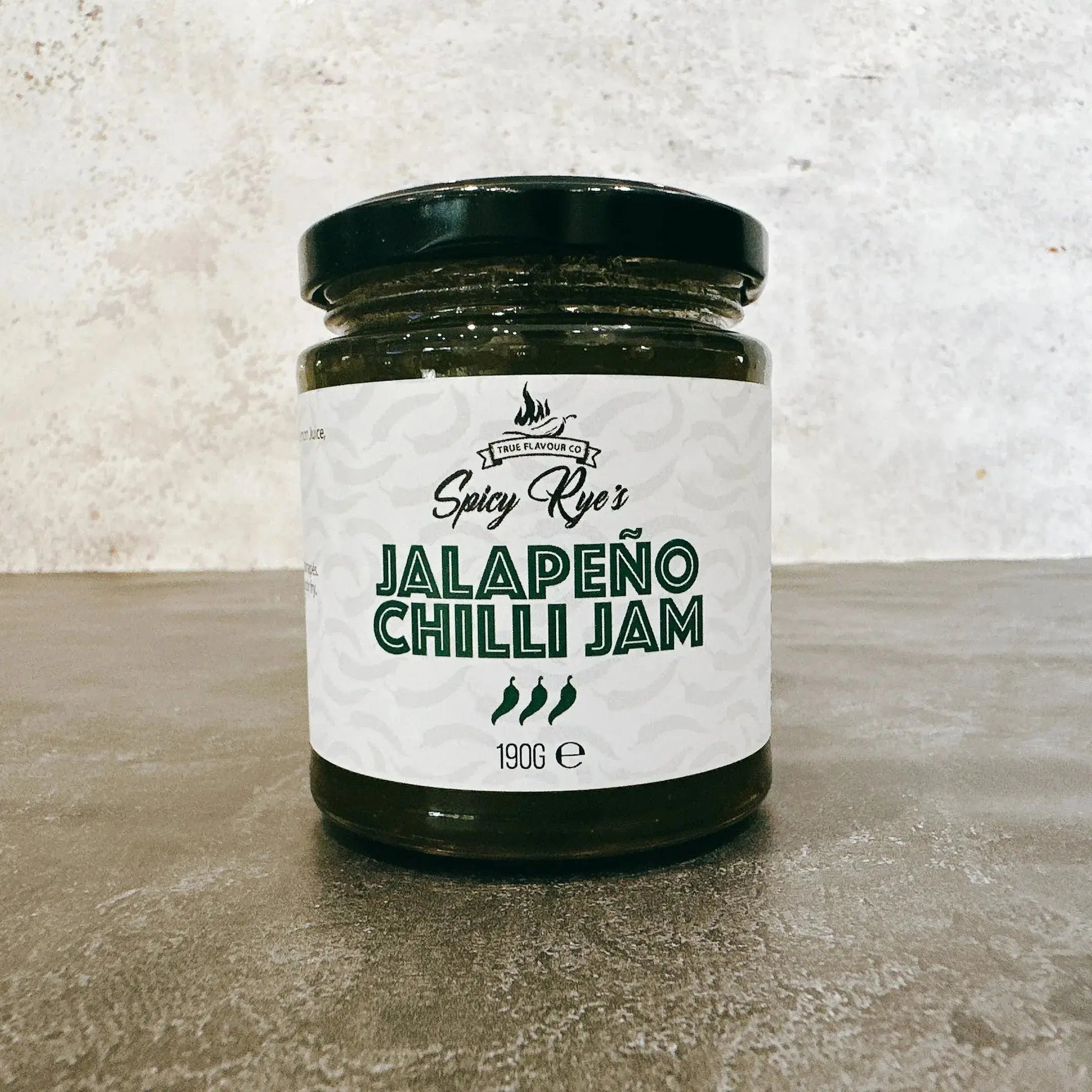 Spicy Ryes Chilli Jam Medley Gift Set featuring three jars of spicy chili jams with vibrant labels and decorative packaging.