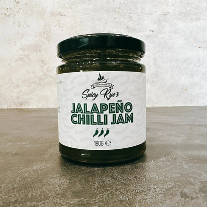 Spicy Ryes Chilli Jam Medley Gift Set featuring three jars of spicy chili jams with vibrant labels and decorative packaging.