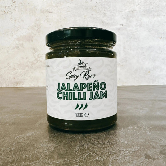 Spicy Ryes Jalapeno Chilli Jam jar with vibrant red jam visible inside, showcasing the spicy, chunky chili preserve.