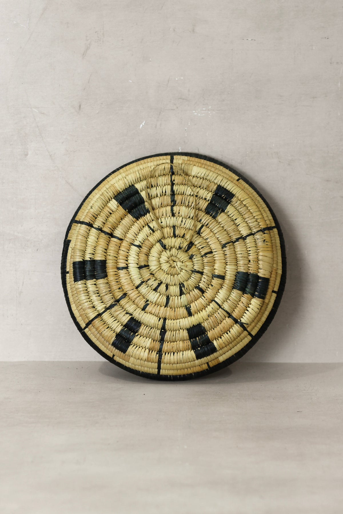 Small Malawi Wall Basket No 10 by Botanical Boys, a decorative wall art piece with woven design and natural materials.