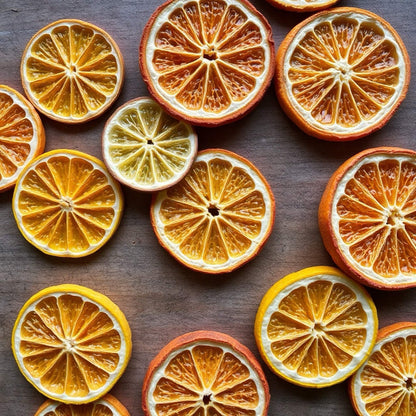 Bright citrus mix from JoJo’s Kitchen featuring an assortment of fresh oranges, lemons, and grapefruits on a wooden surface.