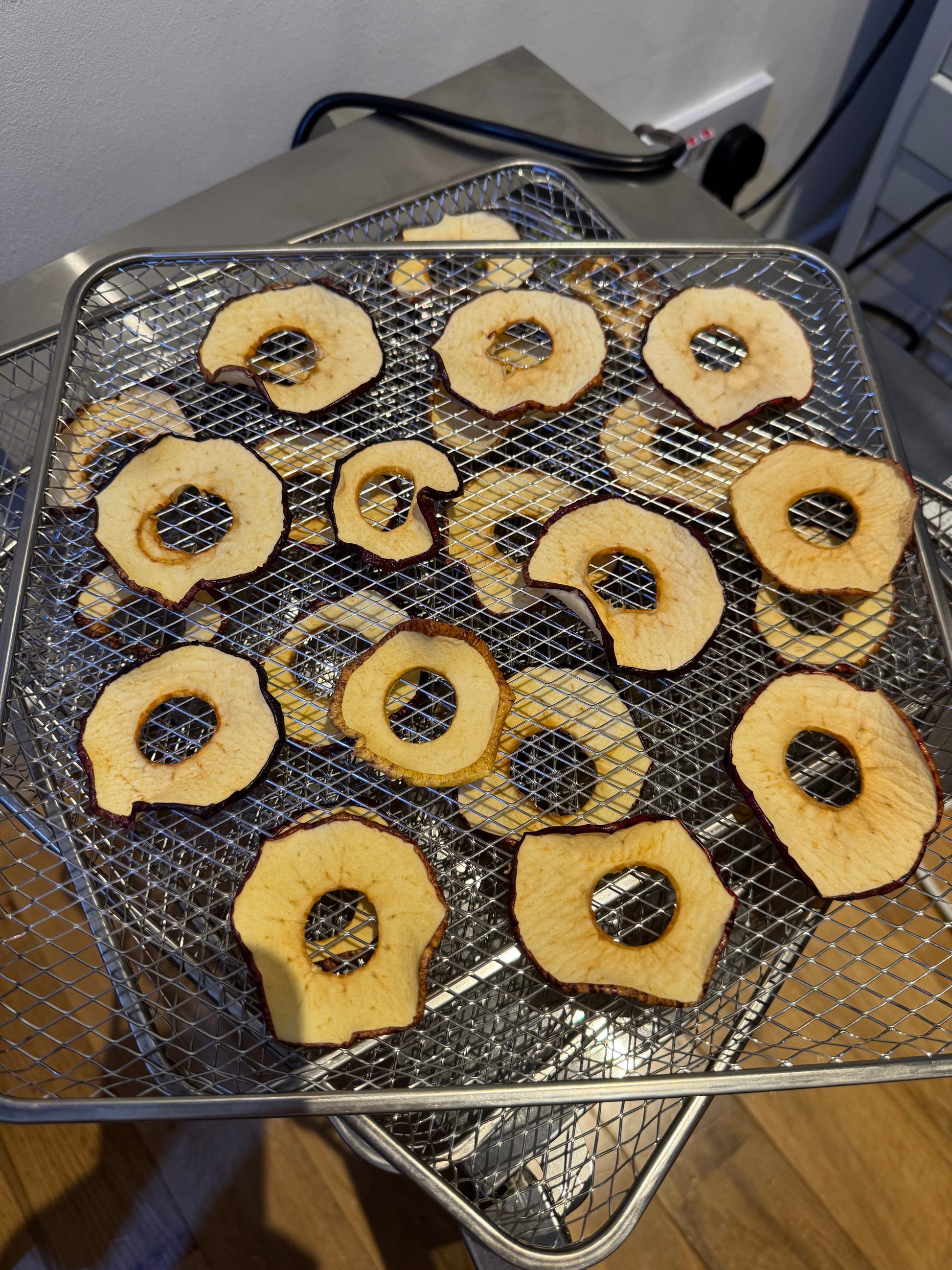Crunchy apple crisps from JoJo’s Kitchen, golden brown and ready to enjoy as a sweet snack or dessert.