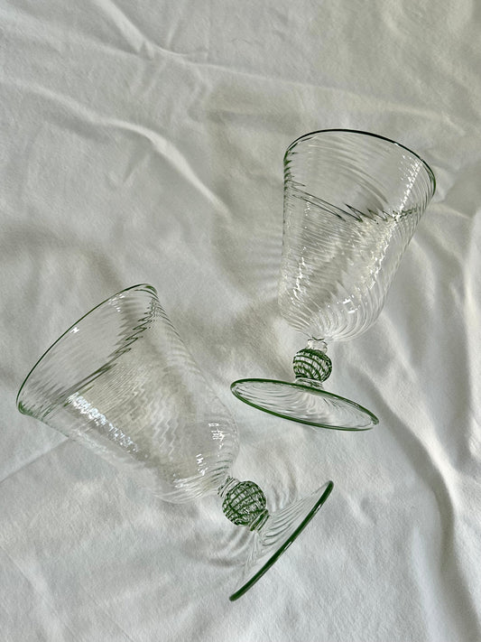 Set of two Domenicamarland Dido Venetian green wine glasses with elegant, curved design, perfect for serving wine in style.