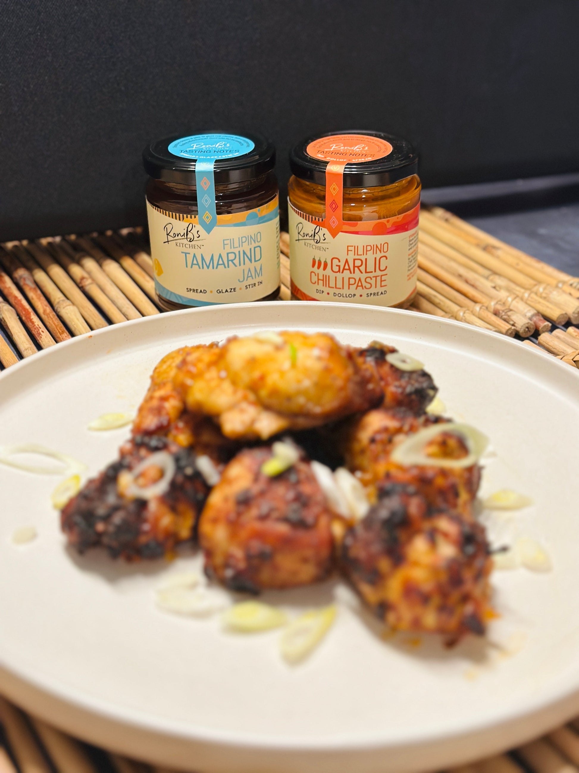 Jar of Filipino Tamarind Jam with Tarsier Gin from RoniBs Kitchen, showcasing the jam's rich texture and vibrant color for cheese pairing.