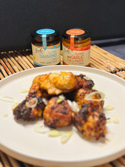 Jar of Filipino Tamarind Jam with Tarsier Gin from RoniBs Kitchen, showcasing the jam's rich texture and vibrant color for cheese pairing.