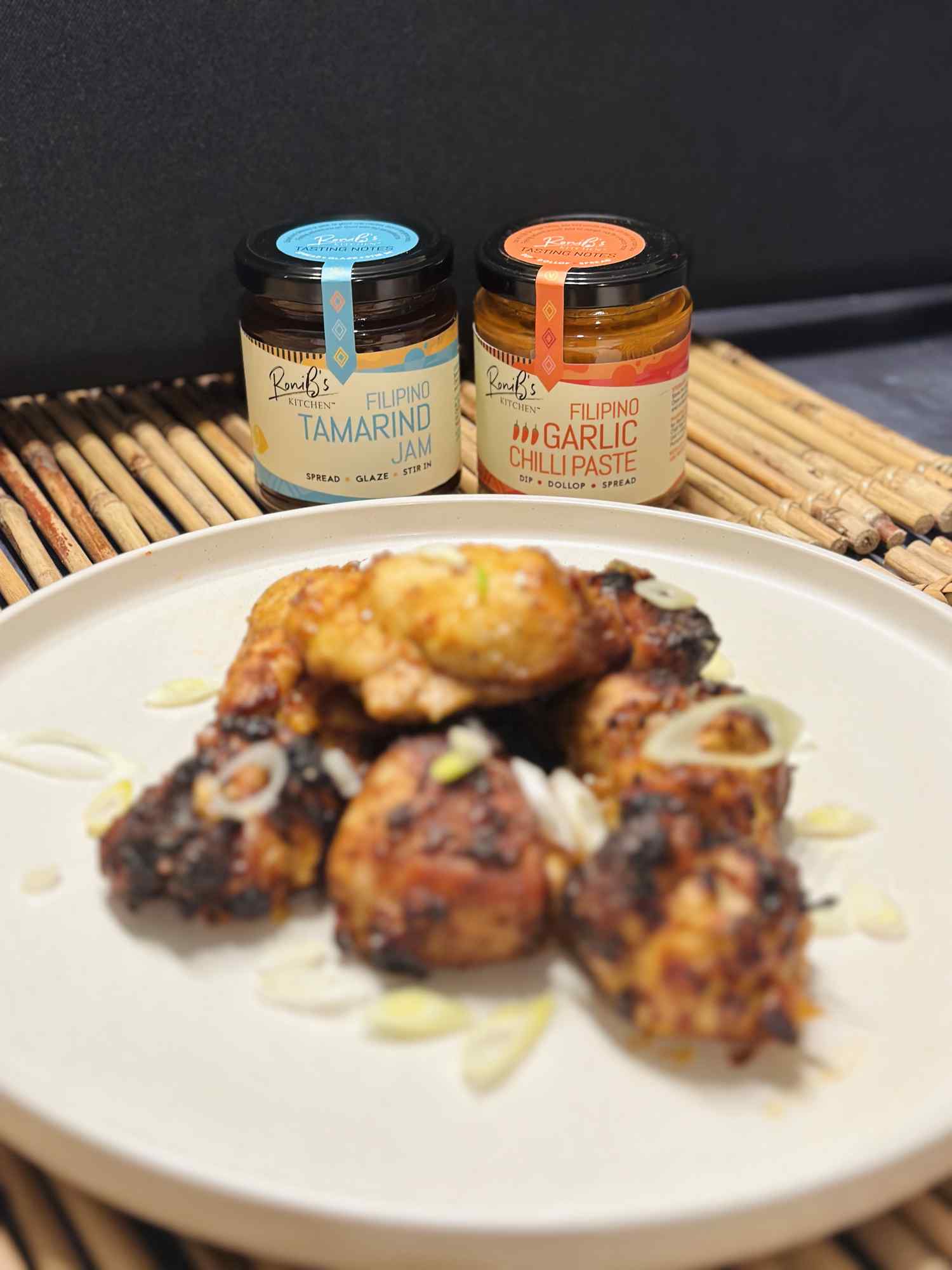 Filipino tamarind jam by RoniBs Kitchen, featuring tarsier gin, served with cheese, in a jar with a label.