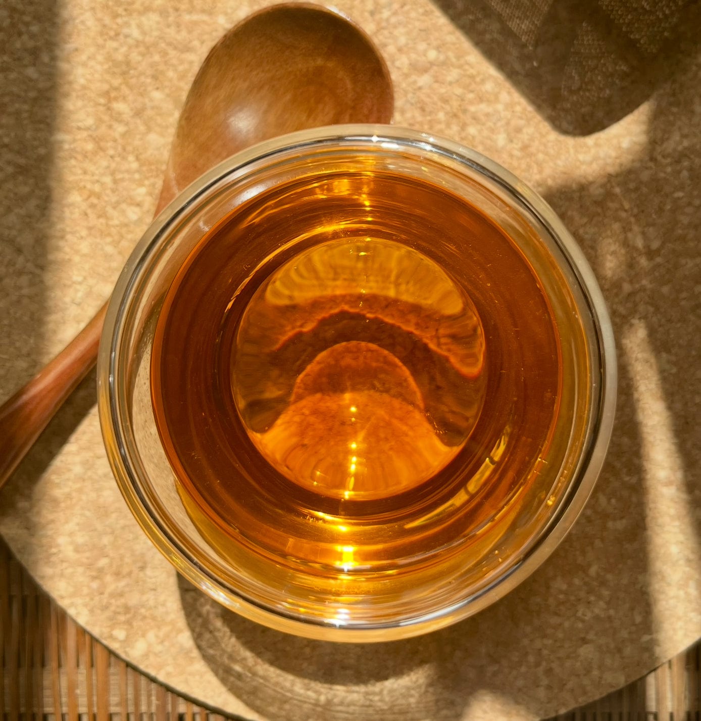 Decaf English Breakfast black tea leaves from Porter Hill Tea Company in a clear glass jar with a tea infuser.