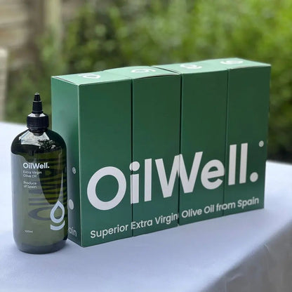 Light and smooth Spanish extra virgin olive oil in a glass bottle, showcasing its golden color and fresh, high-quality appearance.