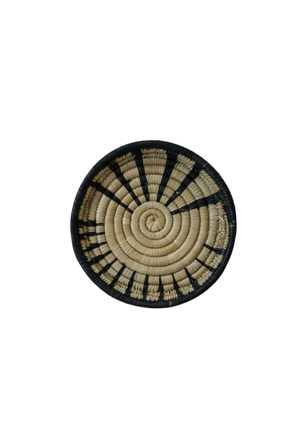 Small Malawi wall basket by Botanical Boys, woven basket with natural fibers, mounted on a wall for decorative storage.