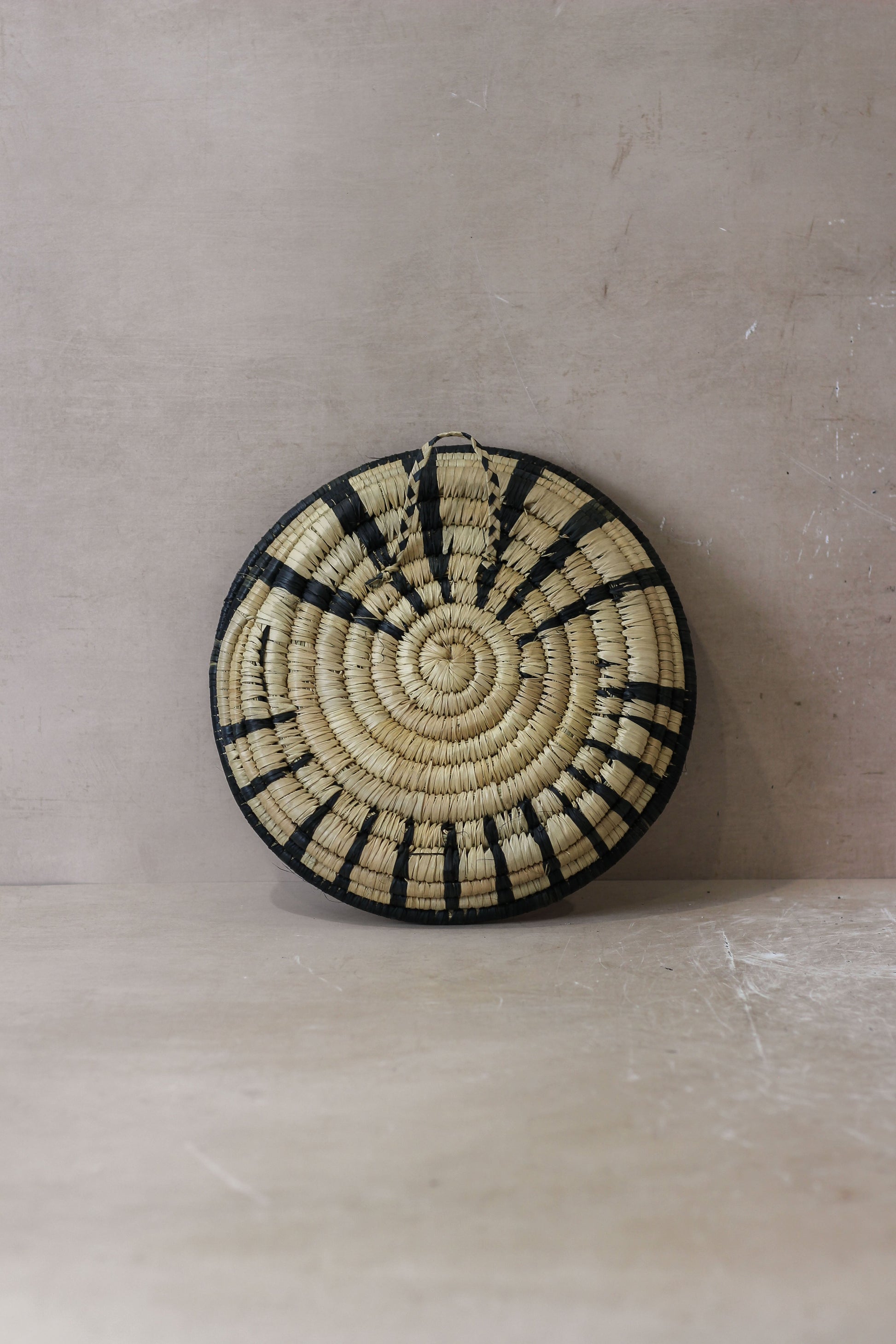 Small Malawi Wall Basket by Botanical Boys, woven basket with natural fibers, designed for wall decor or storage.