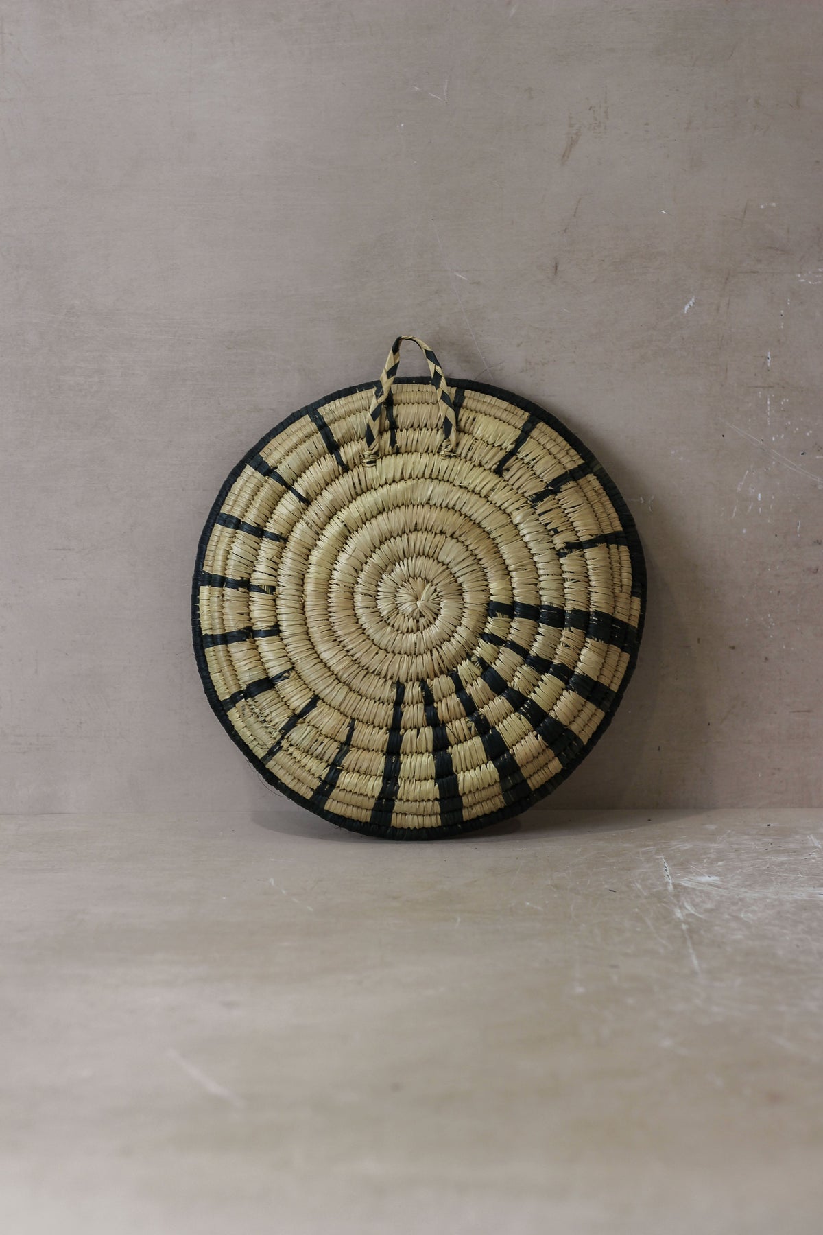 Small Malawi Wall Basket No 2 by Botanical Boys, natural woven basket with a round shape, decorative wall hanging.