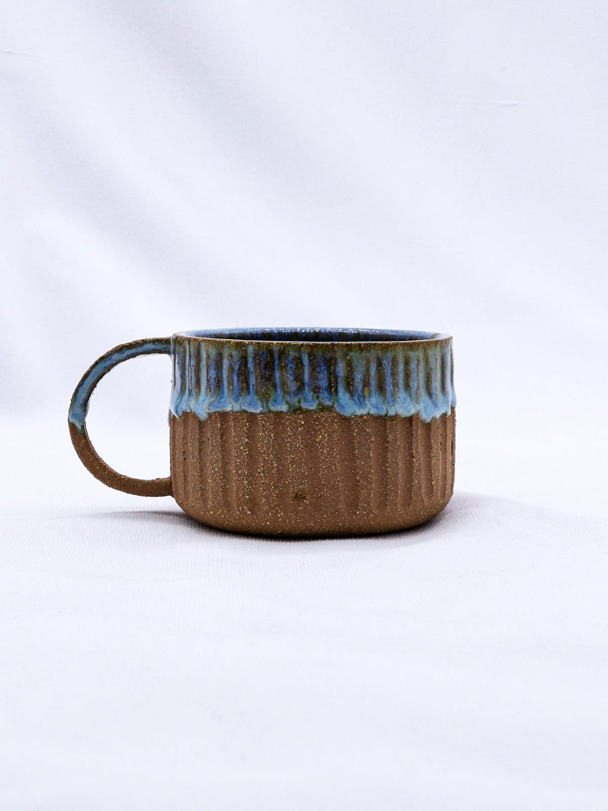 Handmade Terra Stoneware Mug by Ribera Handmade Ceramics with a rustic ceramic finish and unique artisanal design.