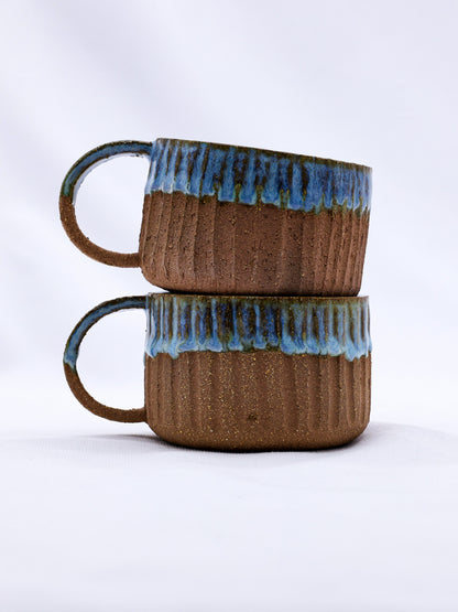 Ribera Handmade Ceramics Bluvio Arte Terra stoneware mug with a handmade ceramic finish and earthy tones.